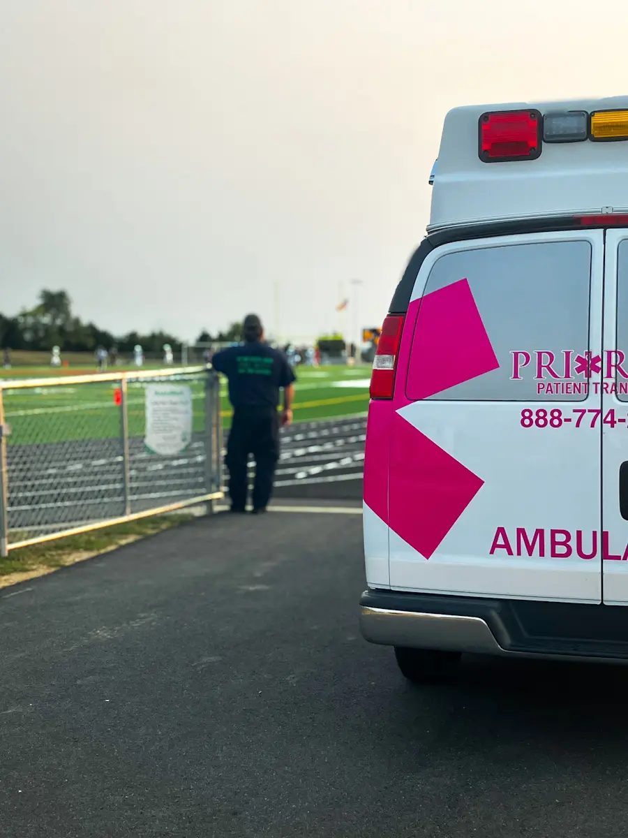 Priority ambulance with an EMT in the background