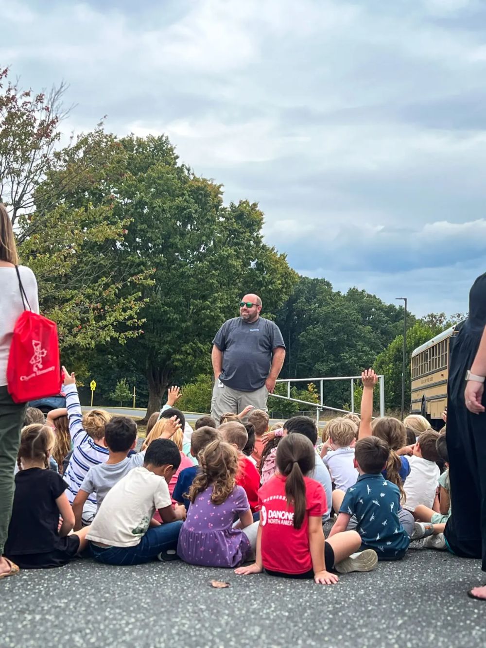 Paramedic educating a group of children